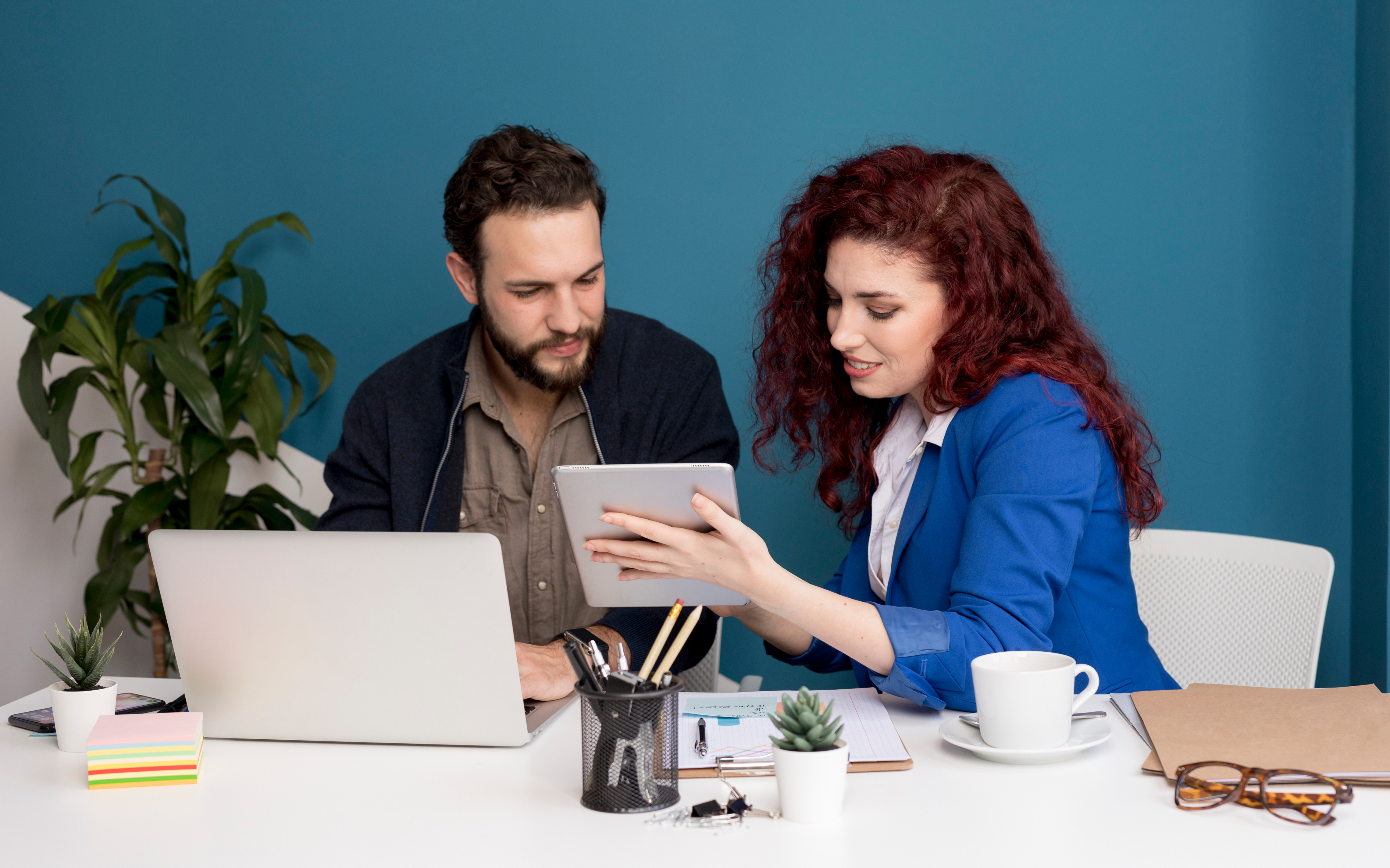 Business owner reviewing VAT registration form with accountant